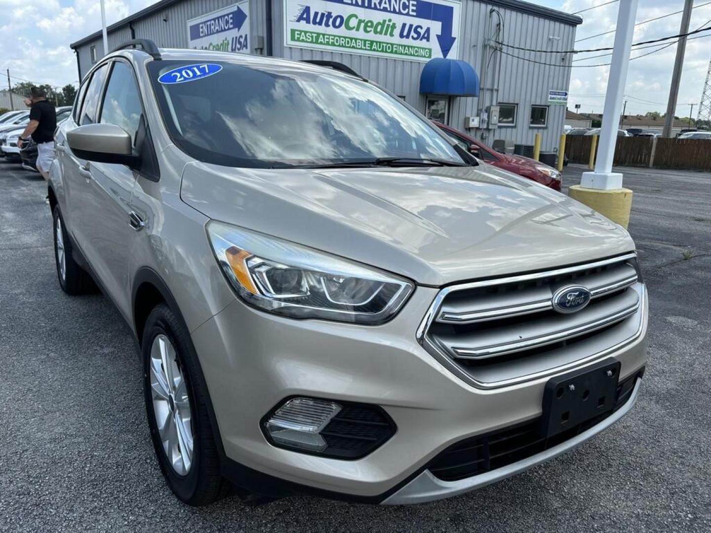 2017 GOLD FORD ESCAPE SE (1FMCU0GD4HU) , located at 100 West Coliseum Boulevard, Fort Wayne, IN, 46805, (260) 471-0567, 41.119961, -85.140312 - Photo#0