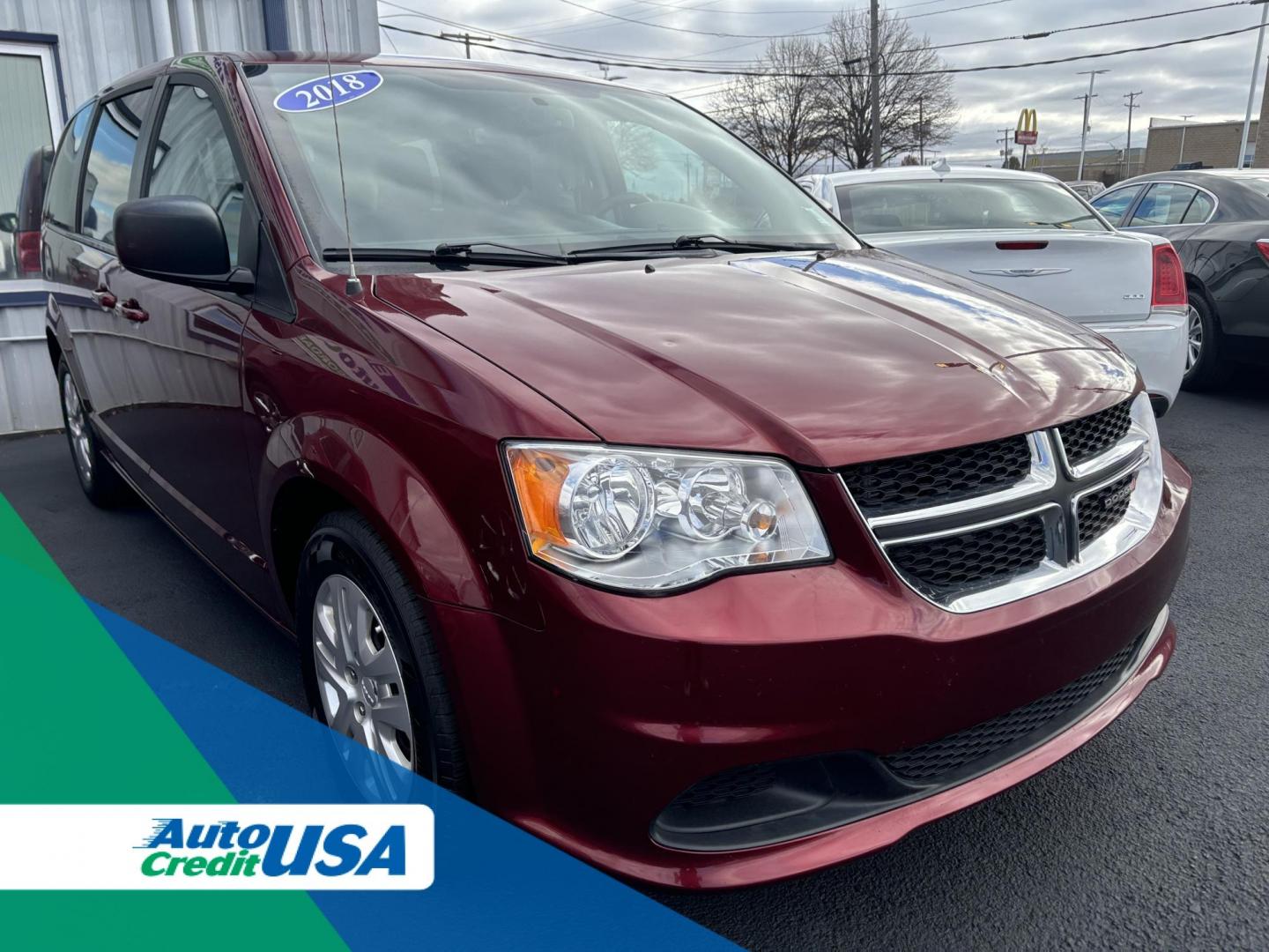 2018 RED DODGE GRAND CARAVAN SE SE (2C4RDGBG9JR) with an 3.6L V6 DOHC 24V engine, 6A transmission, located at 100 West Coliseum Boulevard, Fort Wayne, IN, 46805, (260) 471-0567, 41.119961, -85.140312 - 2018 DODGE GRAND CARAVAN SE SE - Photo#0