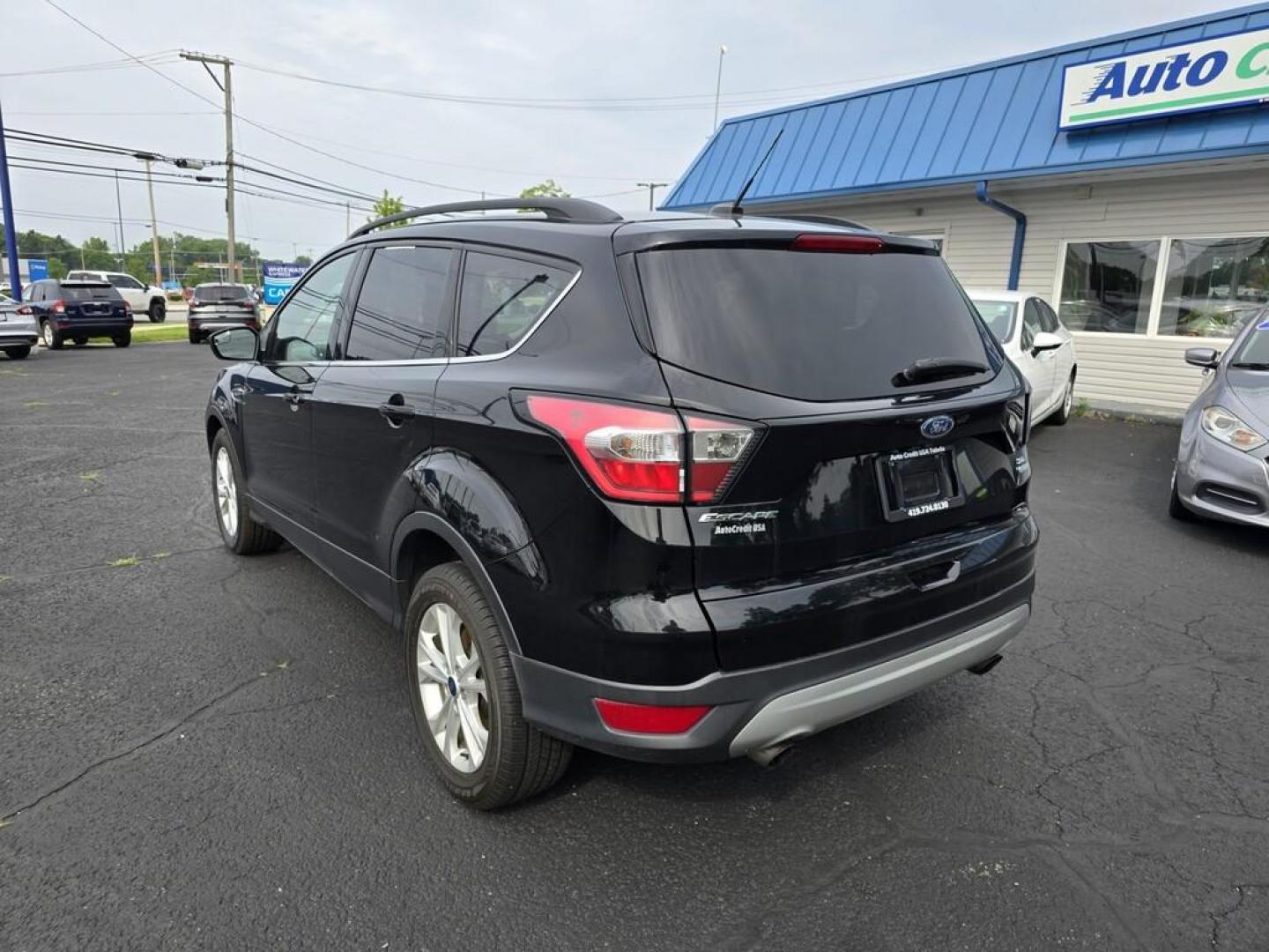 2018 BLACK FORD ESCAPE SE (1FMCU0GDXJU) , located at 5744 Central Avenue, Toledo, OH, 43615, (419) 724-0130, 41.676781, -83.682137 - Photo#5