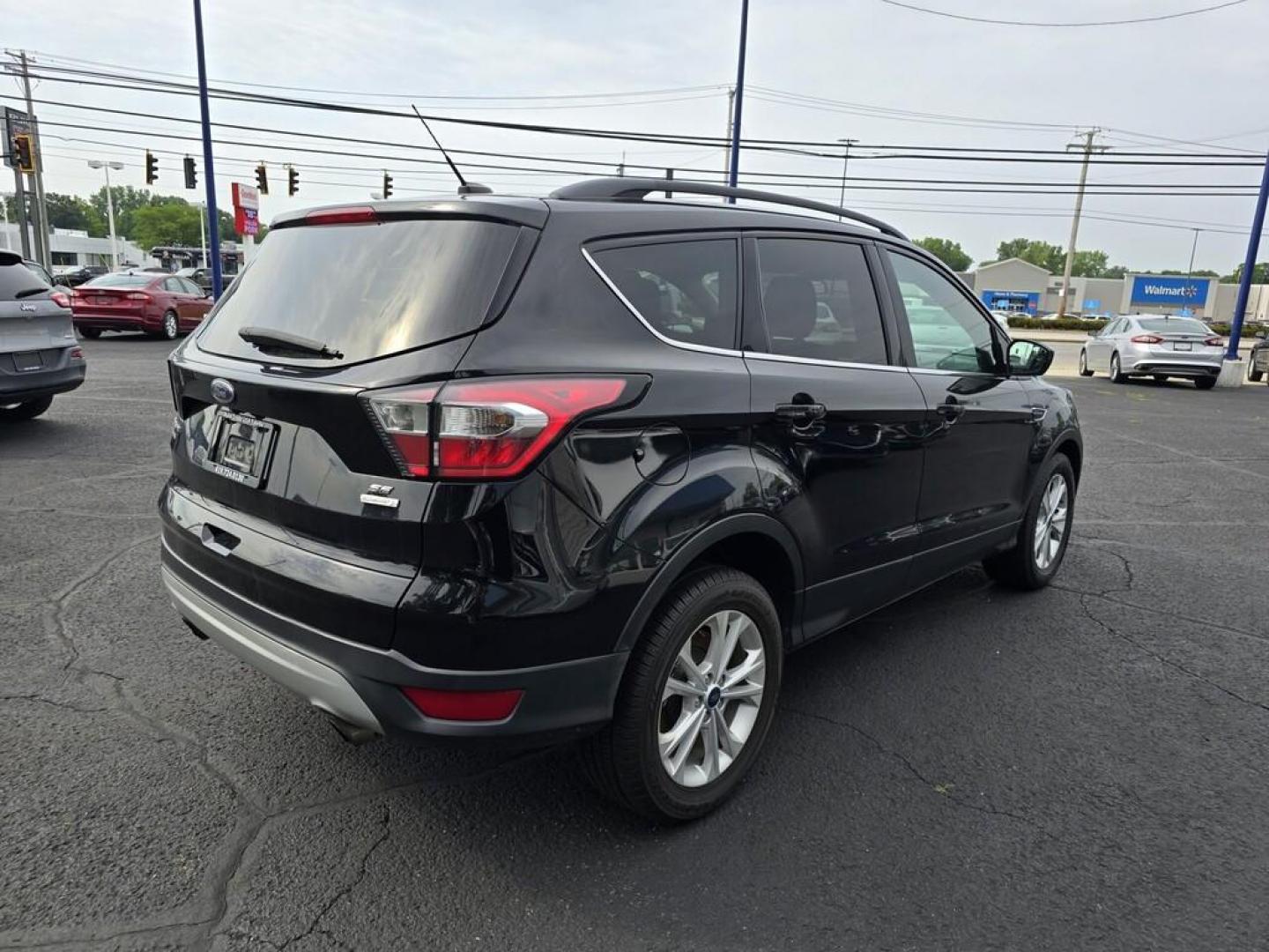 2018 BLACK FORD ESCAPE SE (1FMCU0GDXJU) , located at 5744 Central Avenue, Toledo, OH, 43615, (419) 724-0130, 41.676781, -83.682137 - Photo#7