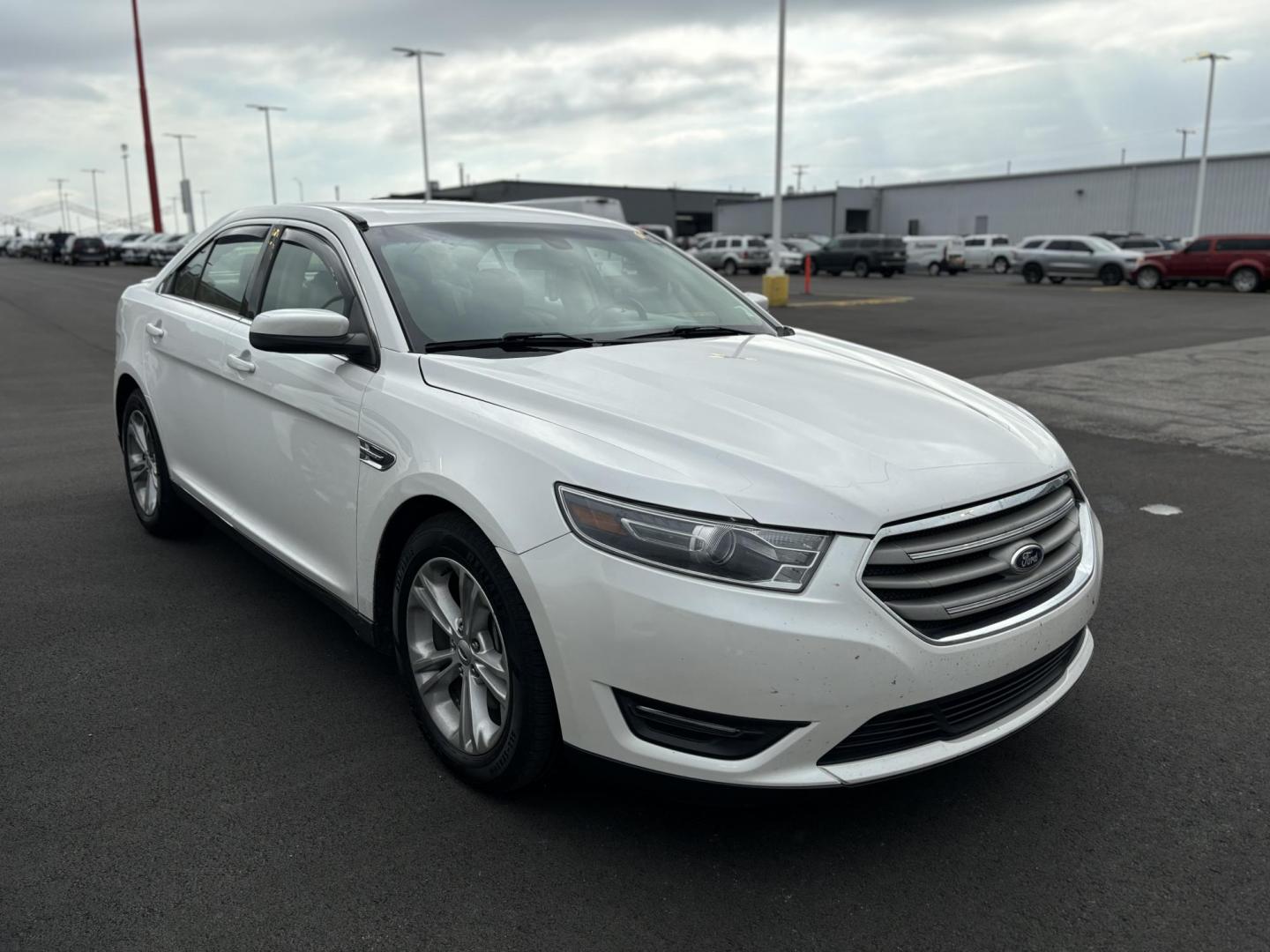 2014 WHITE FORD TAURUS SEL (1FAHP2E80EG) , located at 100 West Coliseum Boulevard, Fort Wayne, IN, 46805, (260) 471-0567, 41.119961, -85.140312 - Photo#0