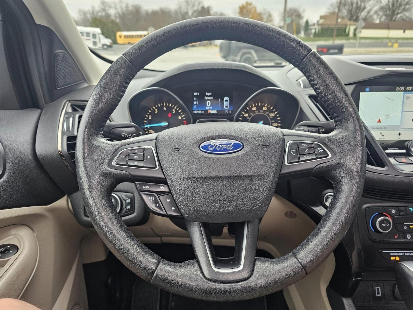 2017 GOLD /Tan FORD ESCAPE TITANIUM Titanium FWD (1FMCU0J90HU) with an 2.0L L4 DOHC 16V engine, 6A transmission, located at 502 South Main Street, Columbia City, IN, 46725, (260) 244-4645, 41.151382, -85.490578 - Photo#7