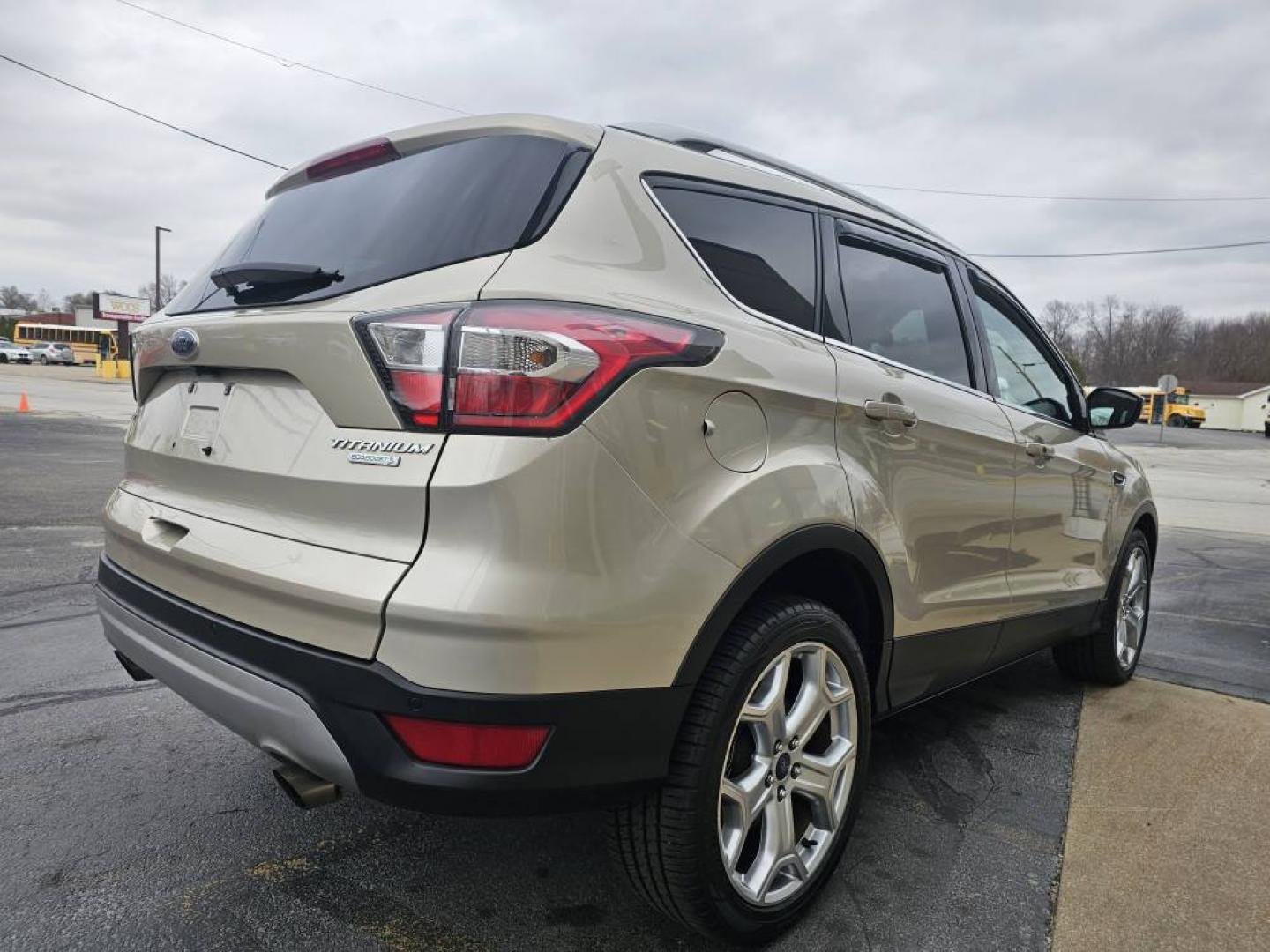 2017 GOLD /Tan FORD ESCAPE TITANIUM Titanium FWD (1FMCU0J90HU) with an 2.0L L4 DOHC 16V engine, 6A transmission, located at 502 South Main Street, Columbia City, IN, 46725, (260) 244-4645, 41.151382, -85.490578 - Photo#2