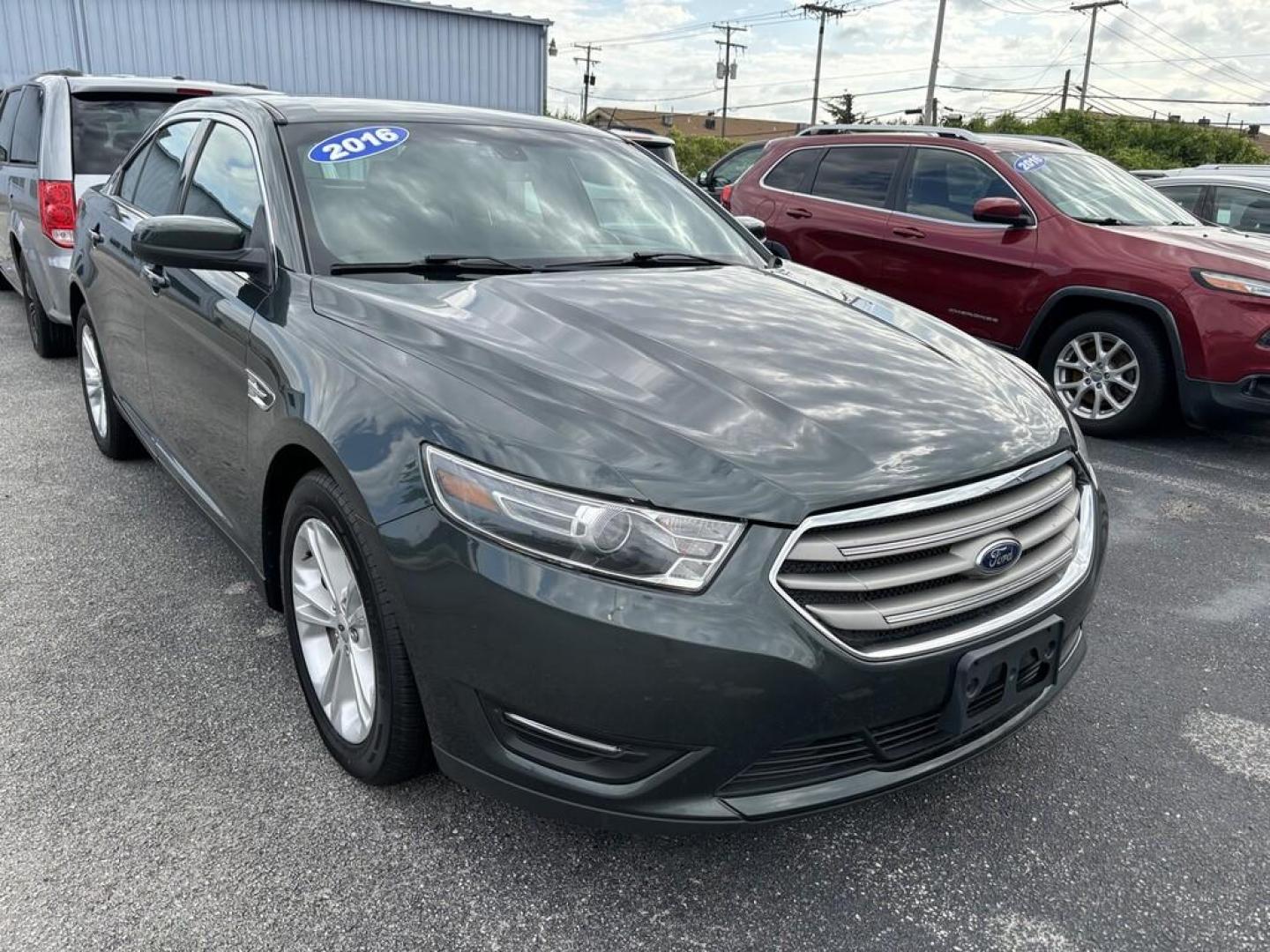 2016 GREEN Ford TAURUS SEL (1FAHP2E83GG) , located at 100 West Coliseum Boulevard, Fort Wayne, IN, 46805, (260) 471-0567, 41.119961, -85.140312 - Photo#0