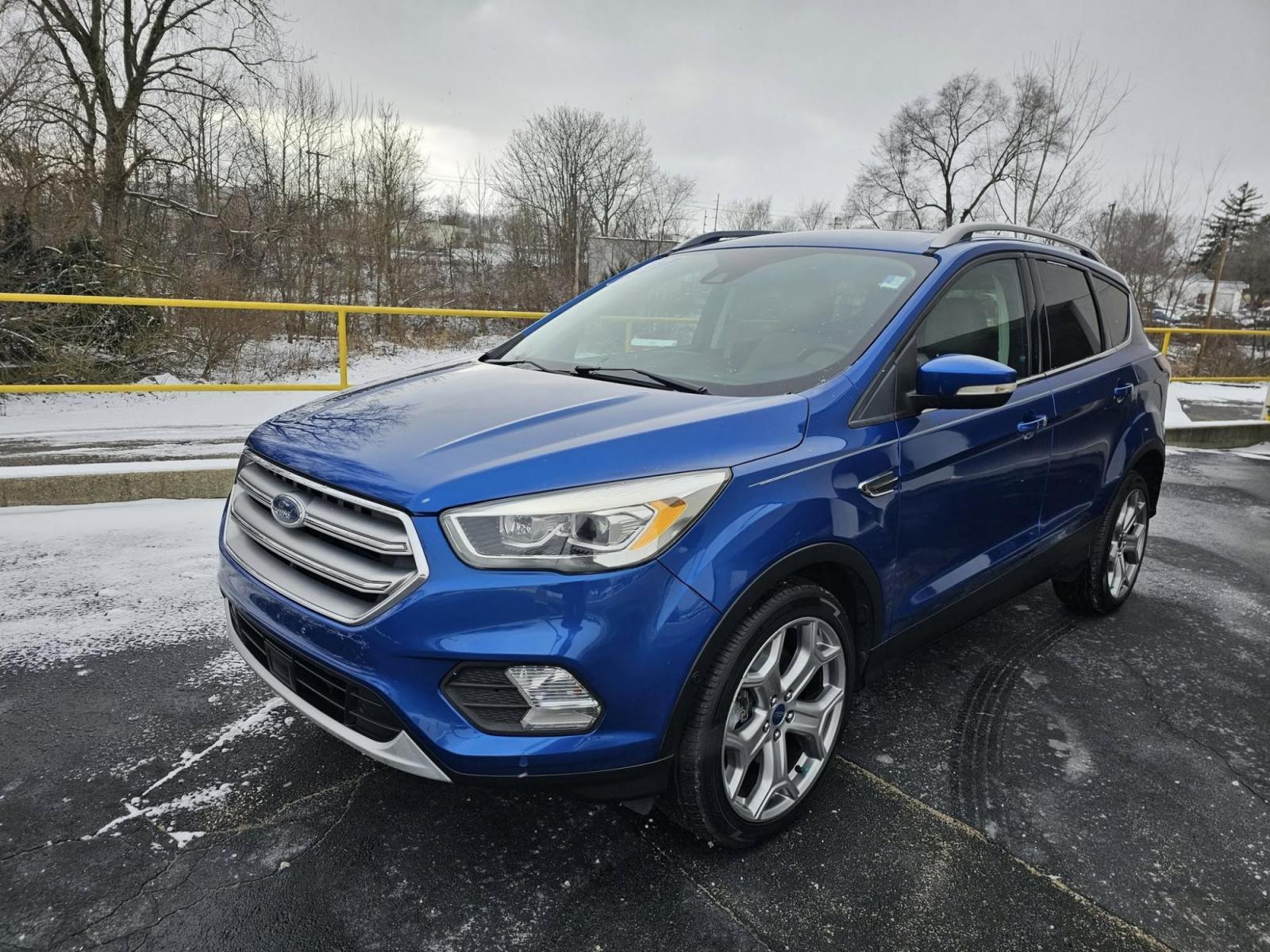 2017 BLUE /BLACK Ford ESCAPE Titanium FWD (1FMCU0J94HU) with an 2.0L L4 DOHC 16V engine, 6A transmission, located at 502 South Main Street, Columbia City, IN, 46725, (260) 244-4645, 41.151382, -85.490578 - 2017 Ford ESCAPE Titanium FWD - Photo#1