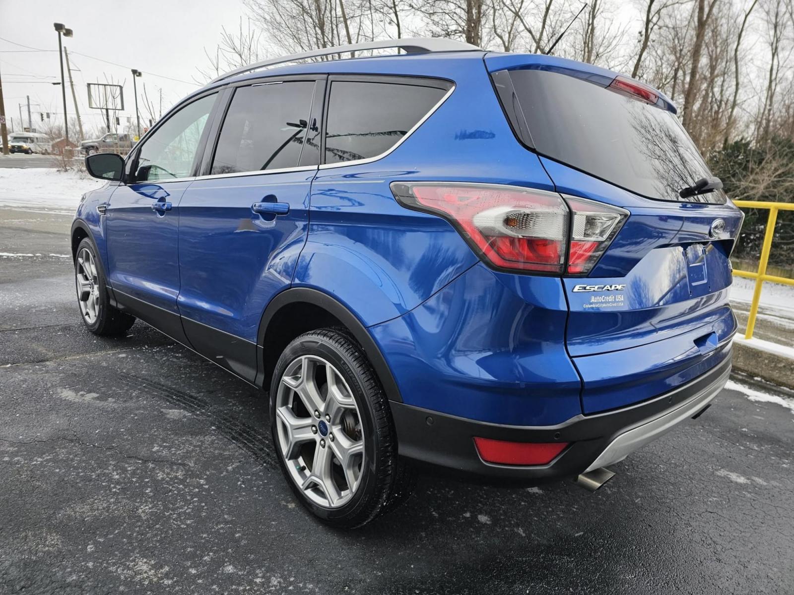 2017 BLUE /BLACK Ford ESCAPE Titanium FWD (1FMCU0J94HU) with an 2.0L L4 DOHC 16V engine, 6A transmission, located at 502 South Main Street, Columbia City, IN, 46725, (260) 244-4645, 41.151382, -85.490578 - 2017 Ford ESCAPE Titanium FWD - Photo#3