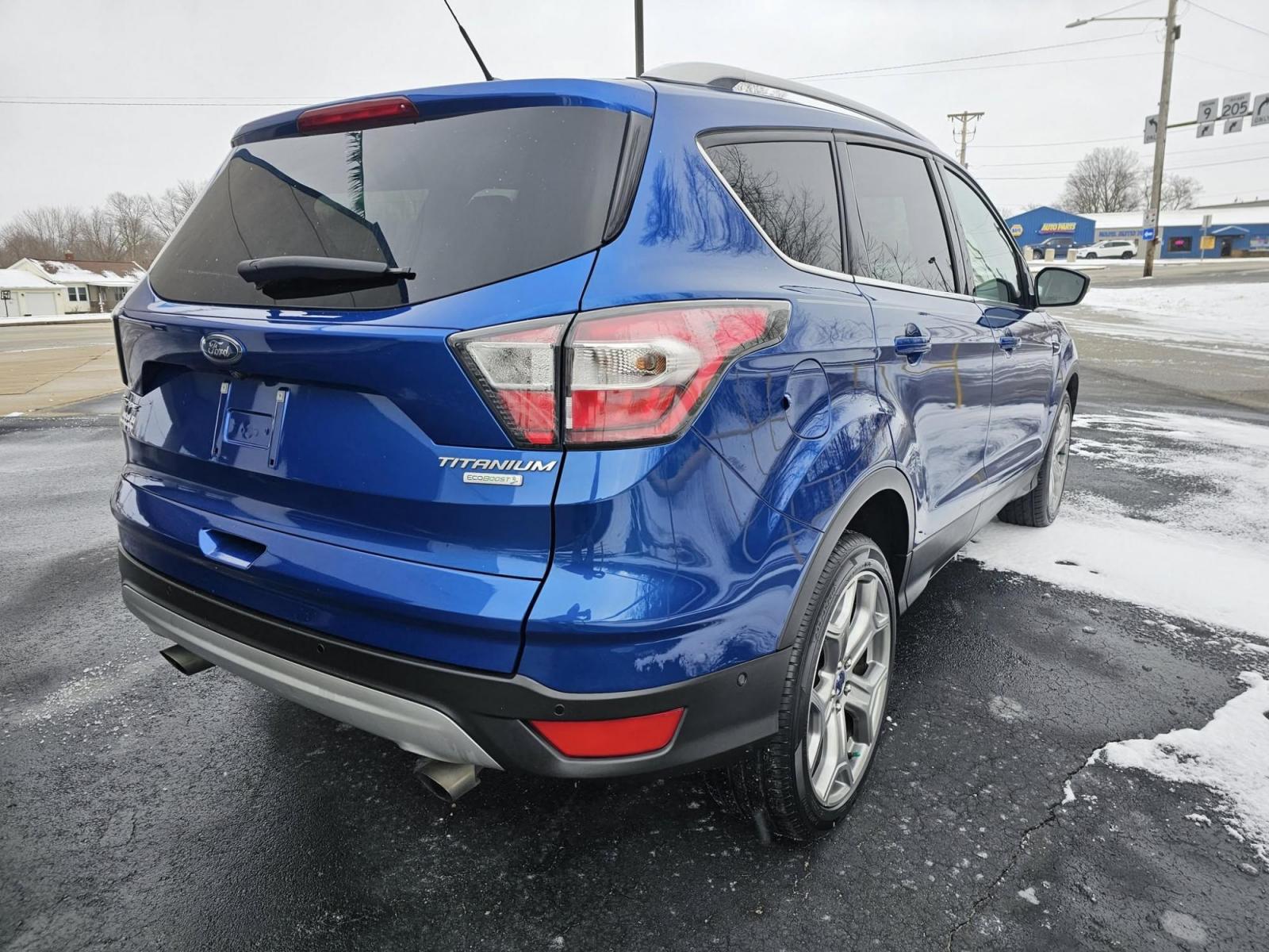 2017 BLUE /BLACK Ford ESCAPE Titanium FWD (1FMCU0J94HU) with an 2.0L L4 DOHC 16V engine, 6A transmission, located at 502 South Main Street, Columbia City, IN, 46725, (260) 244-4645, 41.151382, -85.490578 - 2017 Ford ESCAPE Titanium FWD - Photo#4