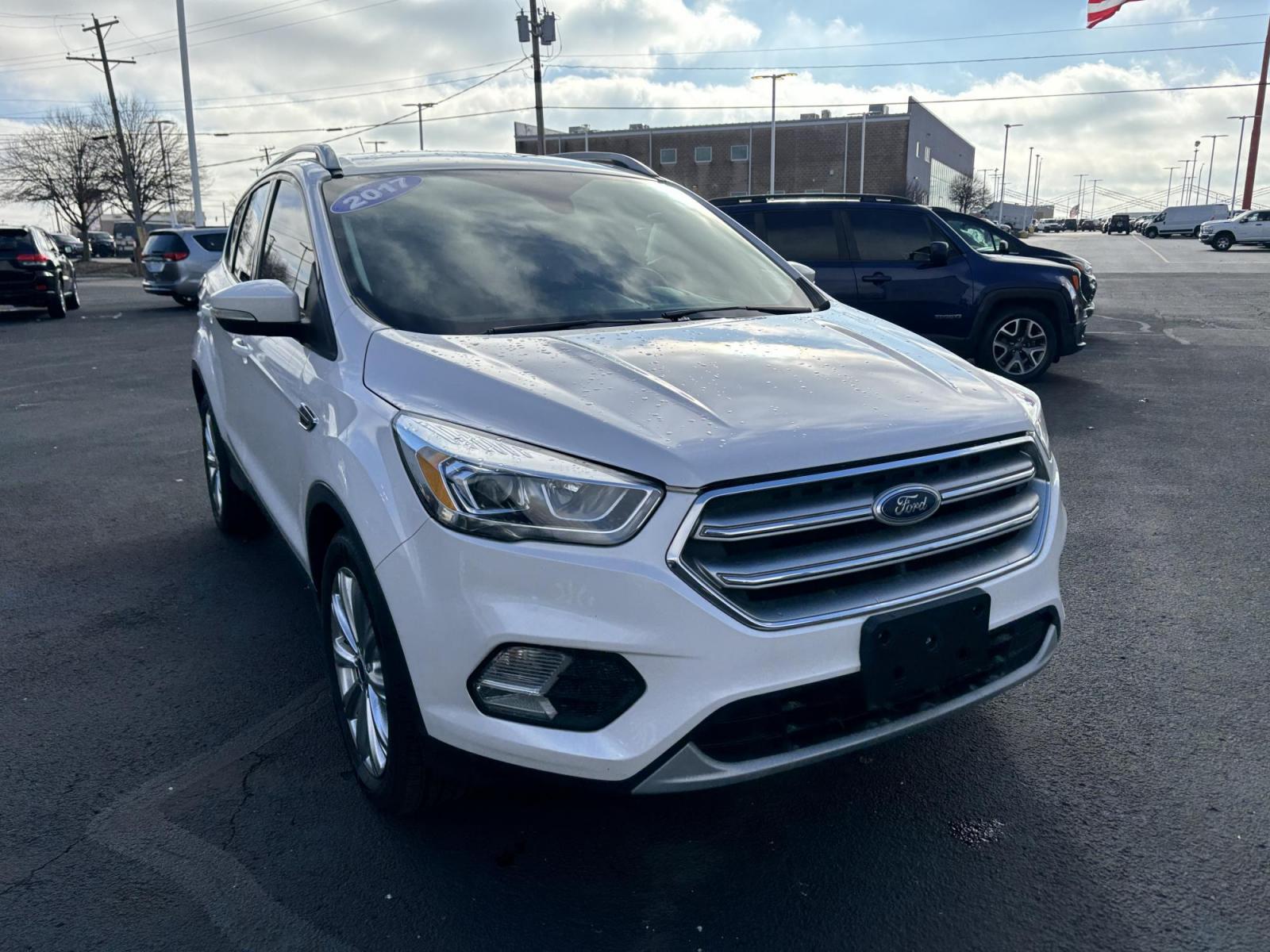 2017 WHITE Ford ESCAPE TITANIUM Titanium FWD (1FMCU0J9XHU) with an 2.0L L4 DOHC 16V engine, 6A transmission, located at 100 West Coliseum Boulevard, Fort Wayne, IN, 46805, (260) 471-0567, 41.119961, -85.140312 - 2017 Ford ESCAPE TITANIUM Titanium FWD - Photo#1