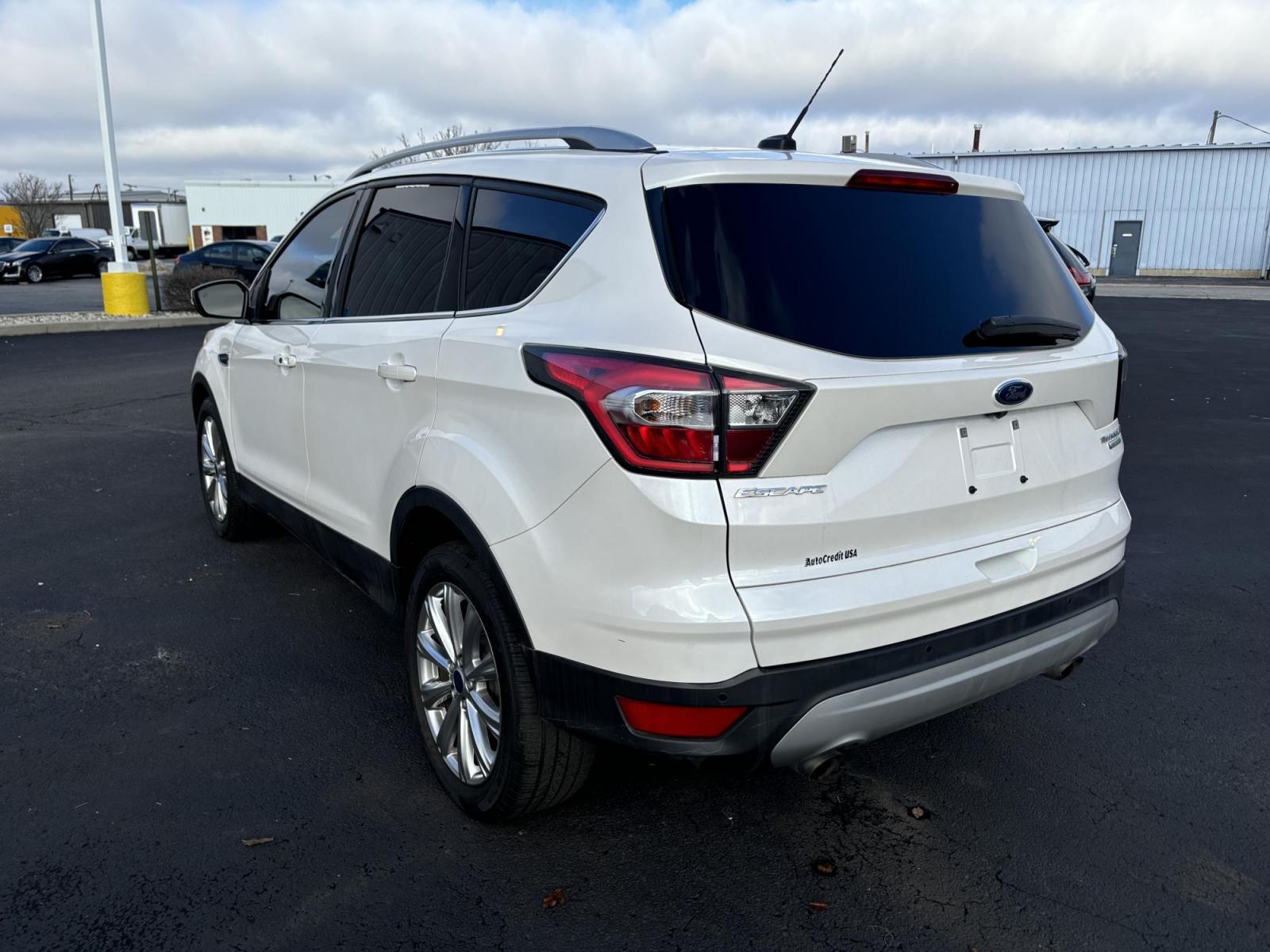 2017 WHITE Ford ESCAPE TITANIUM Titanium FWD (1FMCU0J9XHU) with an 2.0L L4 DOHC 16V engine, 6A transmission, located at 100 West Coliseum Boulevard, Fort Wayne, IN, 46805, (260) 471-0567, 41.119961, -85.140312 - 2017 Ford ESCAPE TITANIUM Titanium FWD - Photo#4