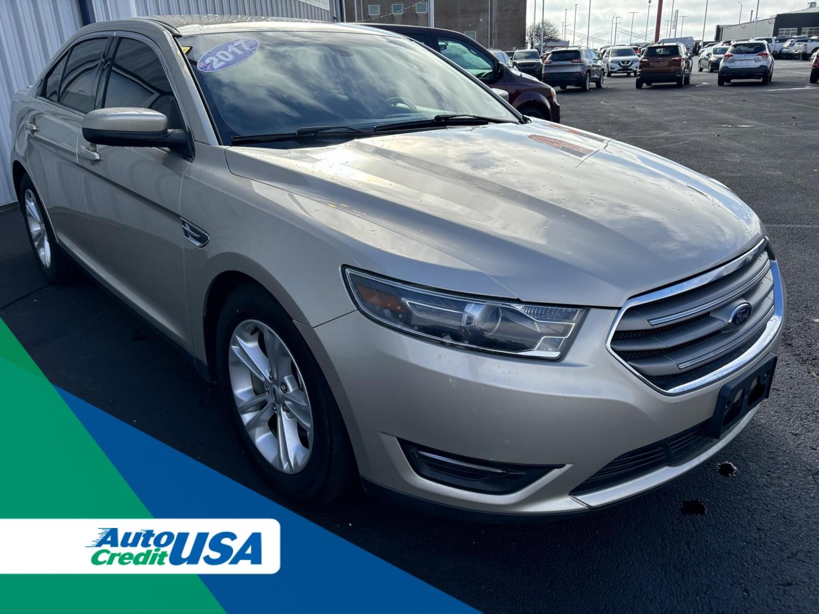 2017 GOLD /Tan Ford TAURUS SEL SEL FWD (1FAHP2E86HG) with an 3.5L V6 DOHC 24V engine, 6A transmission, located at 100 West Coliseum Boulevard, Fort Wayne, IN, 46805, (260) 471-0567, 41.119961, -85.140312 - 2017 Ford TAURUS SEL SEL FWD - Photo#0