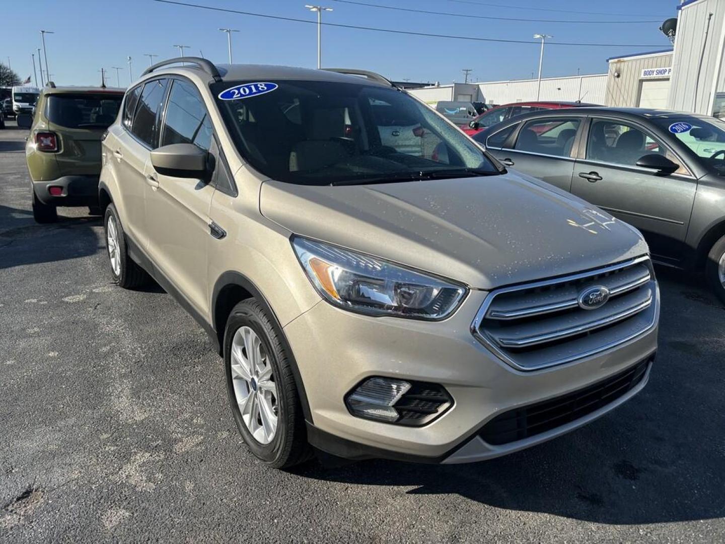 2018 TAN Ford ESCAPE SE (1FMCU0GD2JU) , located at 100 West Coliseum Boulevard, Fort Wayne, IN, 46805, (260) 471-0567, 41.119961, -85.140312 - Photo#0