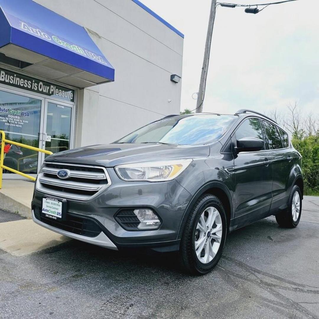 2018 GREY FORD ESCAPE SE SE (1FMCU0GDXJU) with an 1.5L I-4 engine, 6 speed AT transmission, located at 502 South Main Street, Columbia City, IN, 46725, (260) 244-4645, 41.151382, -85.490578 - Photo#0