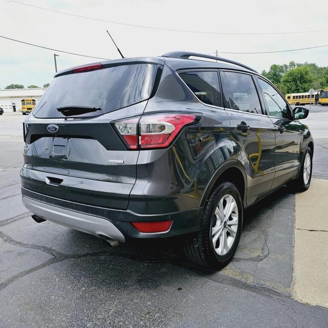 2018 GREY FORD ESCAPE SE SE (1FMCU0GDXJU) with an 1.5L I-4 engine, 6 speed AT transmission, located at 502 South Main Street, Columbia City, IN, 46725, (260) 244-4645, 41.151382, -85.490578 - Photo#2