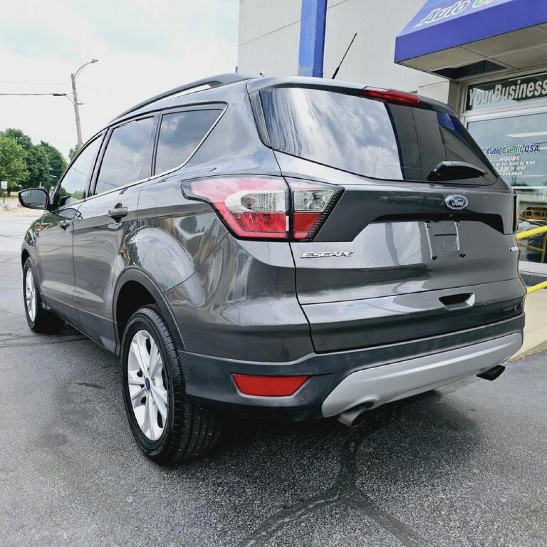 2018 GREY FORD ESCAPE SE SE (1FMCU0GDXJU) with an 1.5L I-4 engine, 6 speed AT transmission, located at 502 South Main Street, Columbia City, IN, 46725, (260) 244-4645, 41.151382, -85.490578 - Photo#3