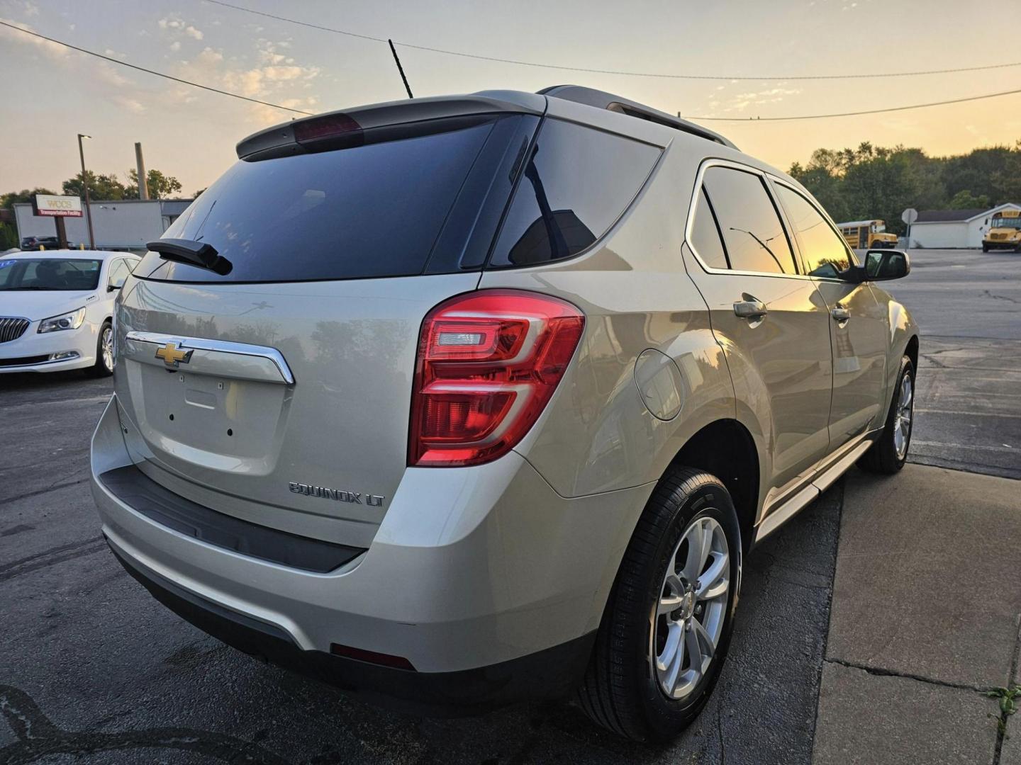 2016 GOLD /BLACK CHEVROLET EQUINOX LT AWD (1GNFLFEK1GZ) with an 2.4L L4 DOHC 16V FFV engine, 6A transmission, located at 502 South Main Street, Columbia City, IN, 46725, (260) 244-4645, 41.151382, -85.490578 - Photo#2