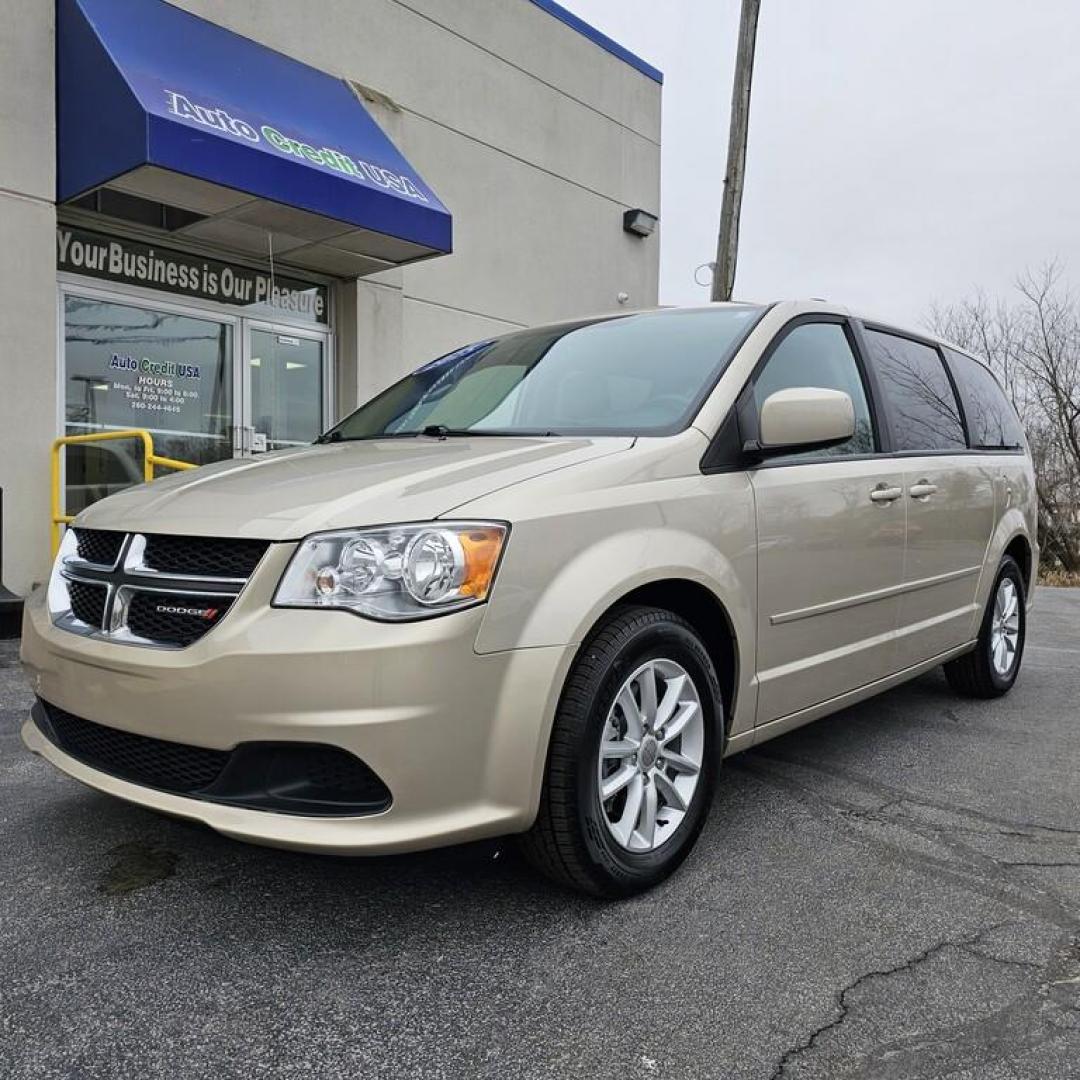 2015 GOLD DODGE GRAND CARAVAN SXT SXT (2C4RDGCG9FR) with an 3.6L V-6 engine, 6 speed AT transmission, located at 502 South Main Street, Columbia City, IN, 46725, (260) 244-4645, 41.151382, -85.490578 - Photo#0